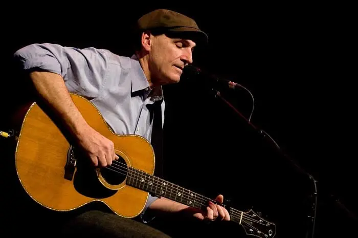 James Taylor playing guitars