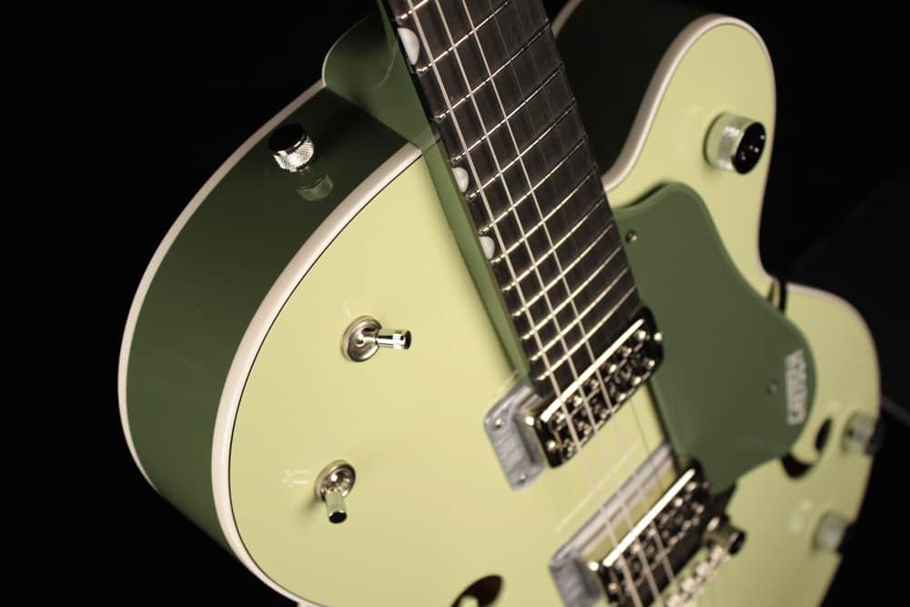 The shape of the Gretsch G6118 is what they call Anniversary. It looks like a modified Les Paul semi hollow design